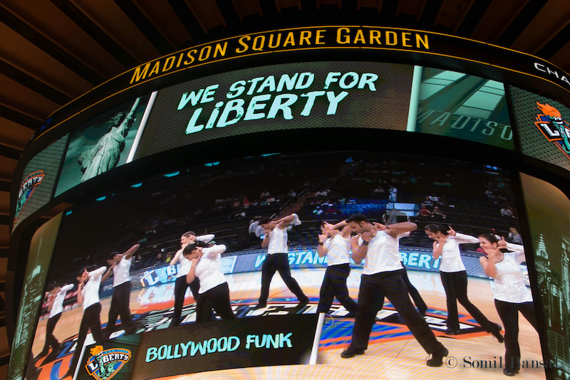 Bollywood dancers from Bollywood Funk NYC perform on Madison Square Garden jumbotron