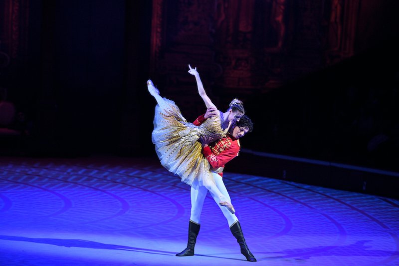 The prince lifts Cinderella at the ball