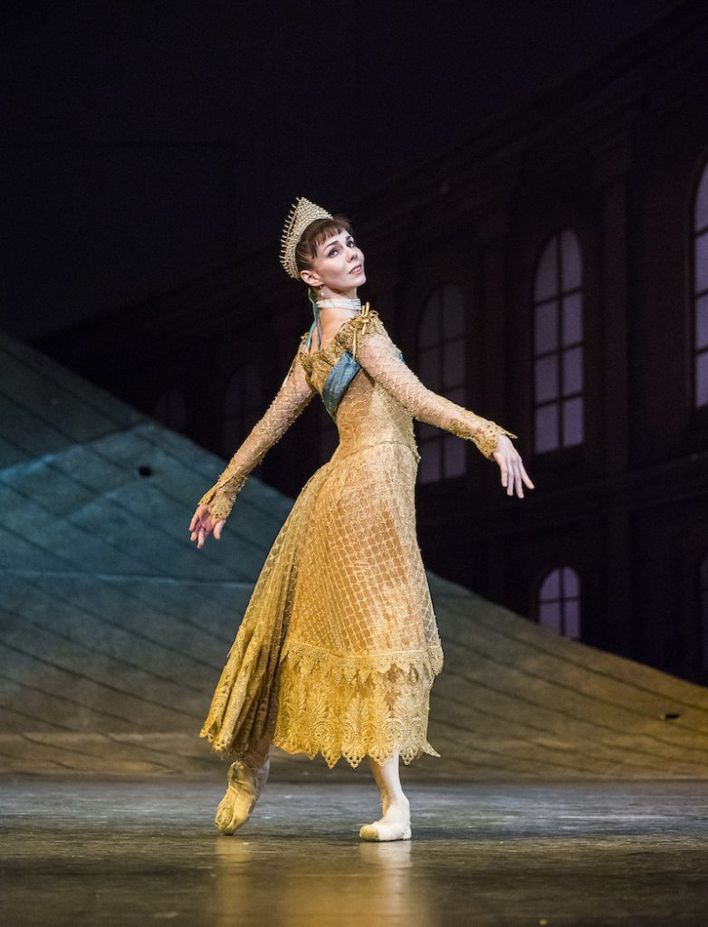 Anastasia wears a gold dress and tiara in the second act of the ballet