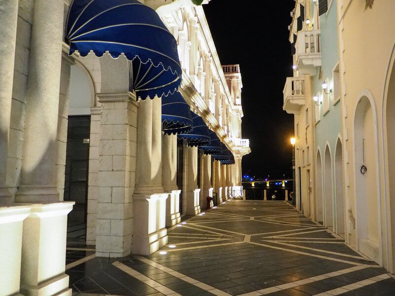 a lit street of Macau Fisherman's Wharf at nighttime