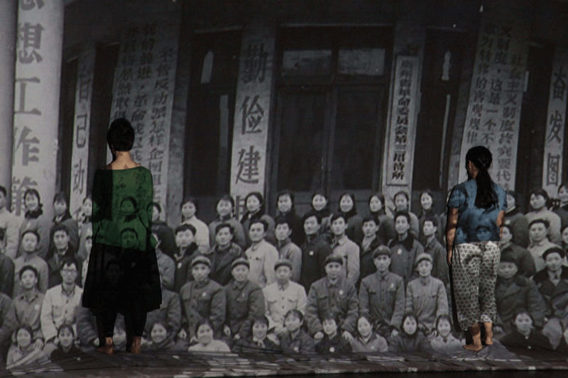 Two women face photograph projection